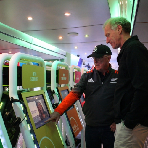 Peter Doak of Inzone Careers Bus shows Neil Geerkens how the technology works.